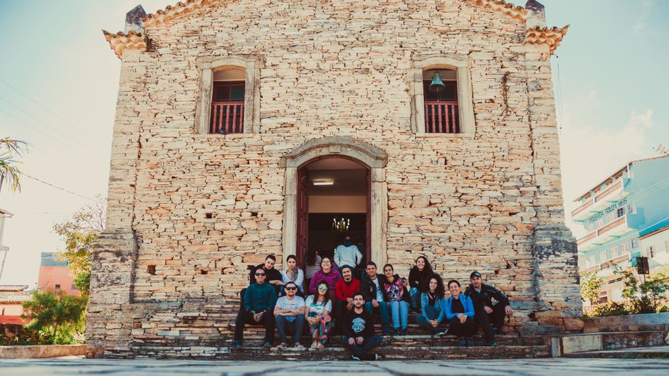 Church fellowship group photo on an outing — medium coach bus transportation
