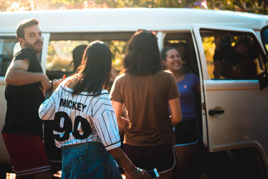 Small church group ready to travel by van for a local mission trip