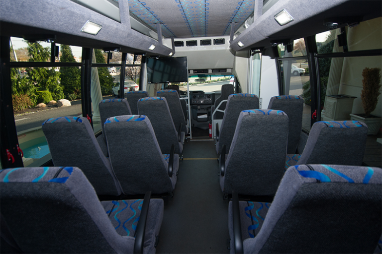 Church mini-coach interior with high-back seating and PA system